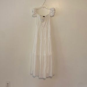 Floor-length white ruffle dress